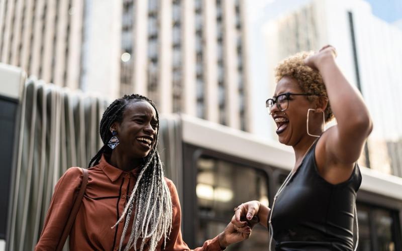 A beautiful community at the heart of all your passions women laughing together in the city