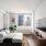 Contemporary bedroom with a large window at Hudson Landing apartments in Hell's Kitchen.