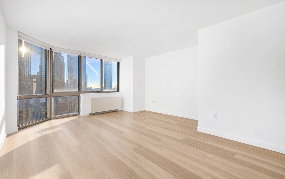 room with large windows and wood floors
