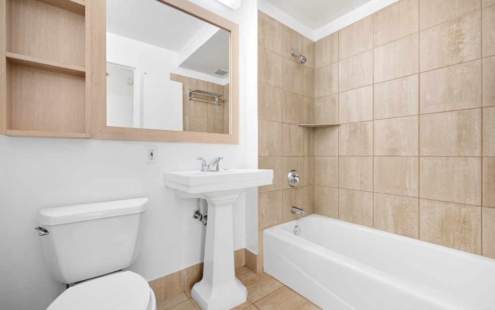 bathroom with toilet sink and tub