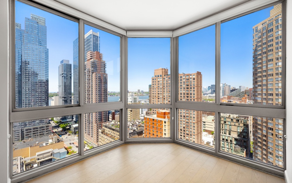 large window with view of a city