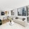 Living and dining area with city views at Hudson Landing Hell's Kitchen apartments for rent.