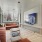 renovated movie lounge with large sectional couch and tv